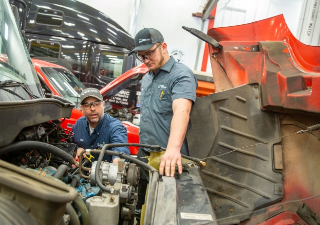 Student and instructor working on diesel truck
