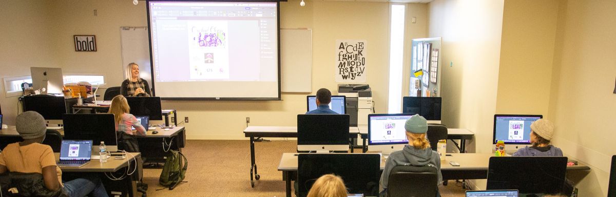 Marketing and Design students working on designs on computers