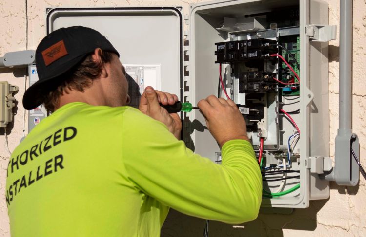 electrician working on electrical box