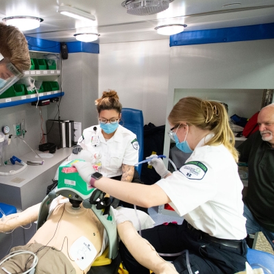 Paramedicine students with instructor in ambulance
