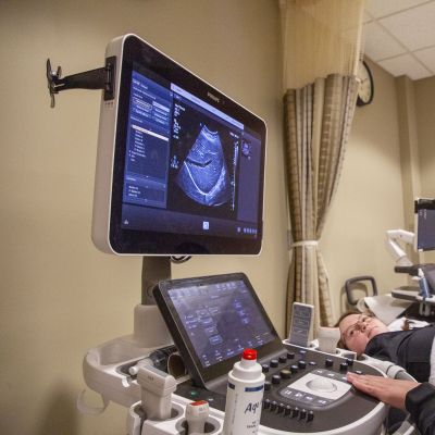 student looks at screen while scanning