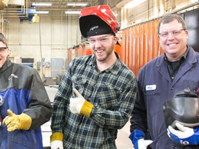 Group of welding students and instructor