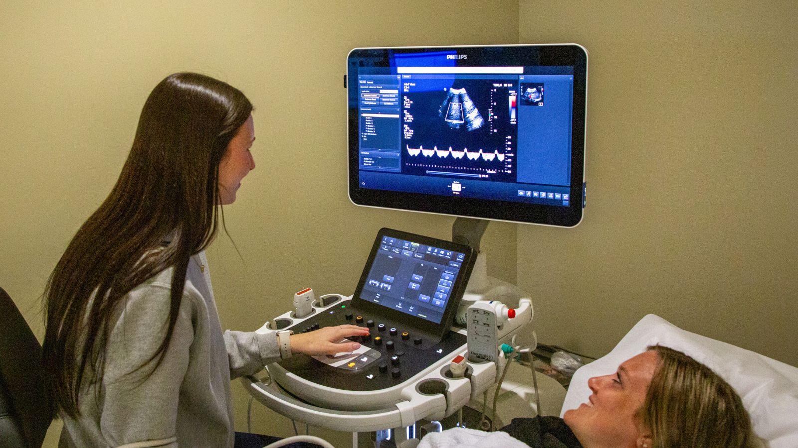 Sonographer reviewing results with patient