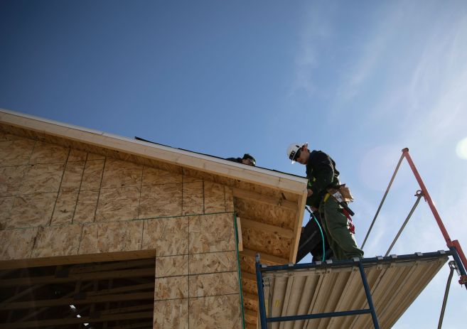 Carpentry students working on roof