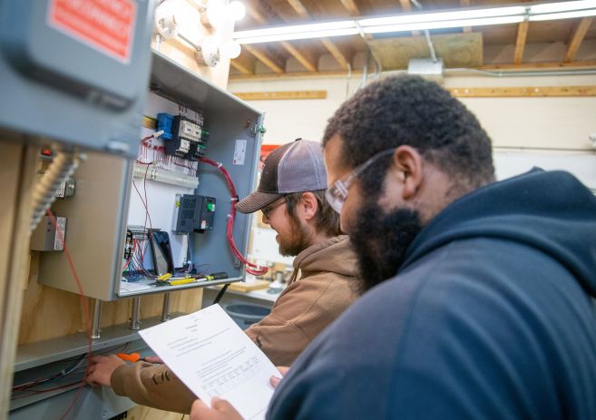 Electrical students working with wires