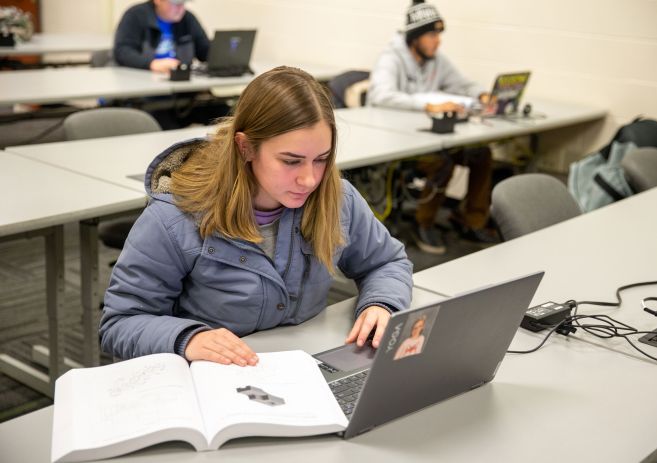 Mechanical design student with laptop