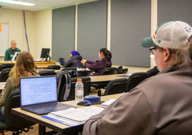 Accounting students in classroom with computers