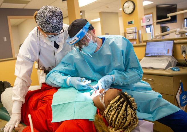 Dental Hygiene student practicing on patient