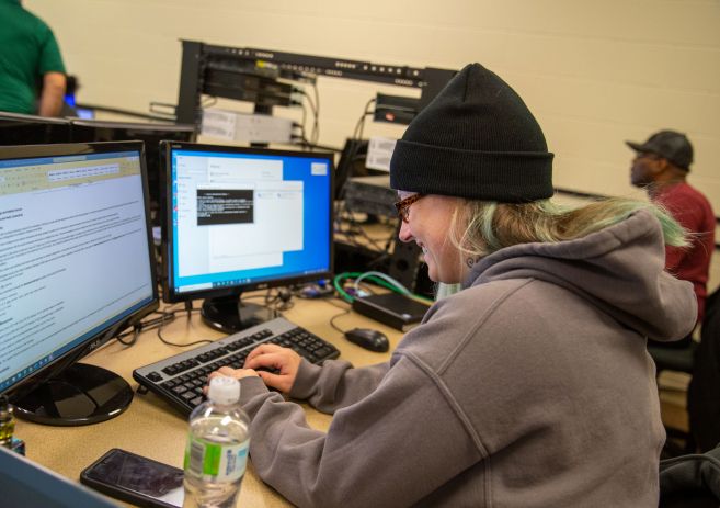 Woman working on IT computers