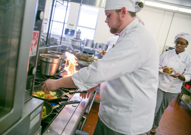 Culinary cooking on a gas range with fire