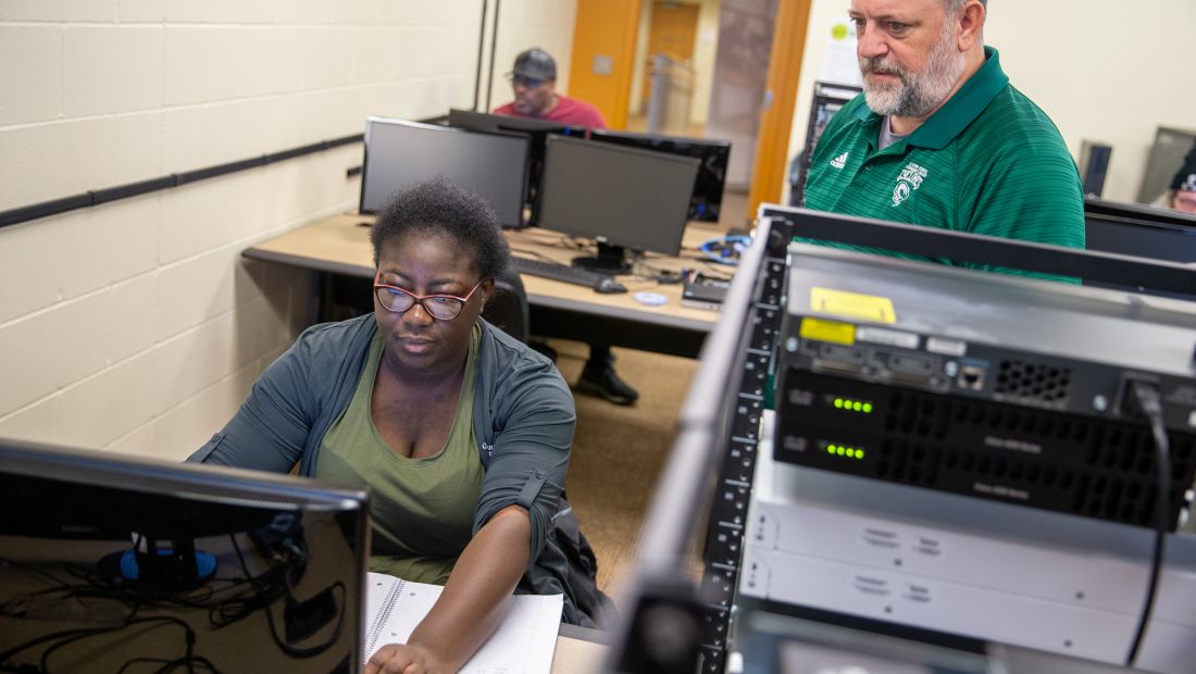 IT student with instructor