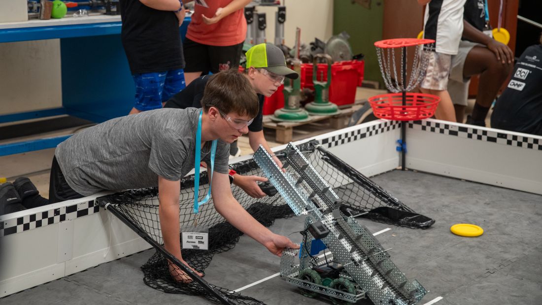 STAR campers placing their robots