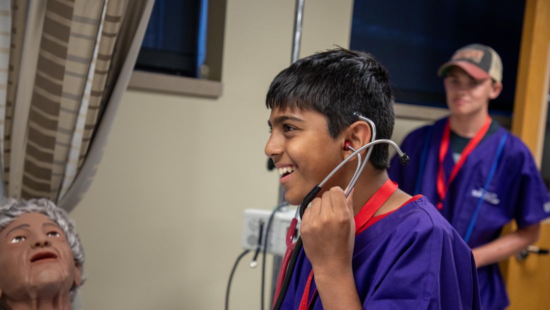 camper listening to stethoscope