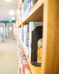 bookshelves with computer stations in the background