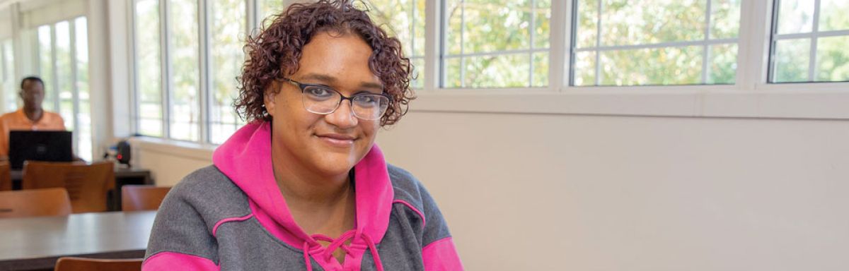 Woman sitting at desk with laptop