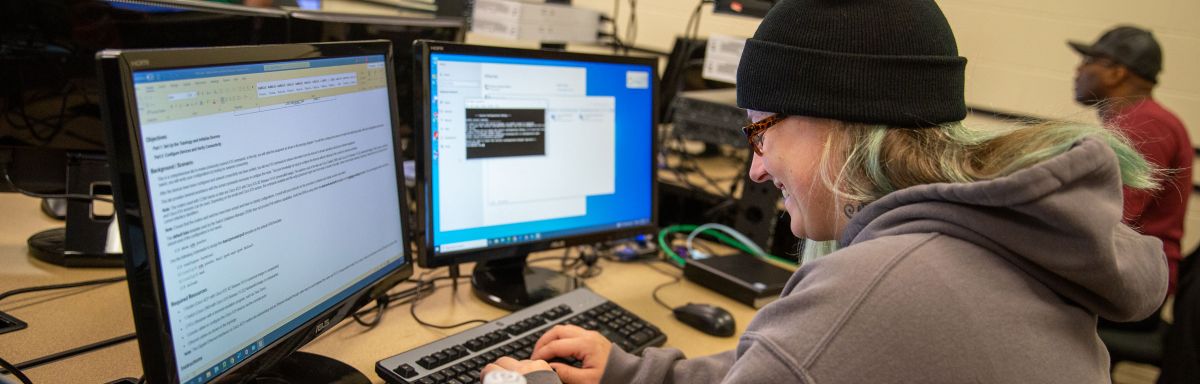 Woman working on IT computers