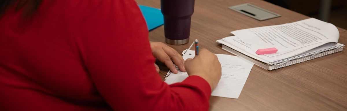 Woman writing on a paper