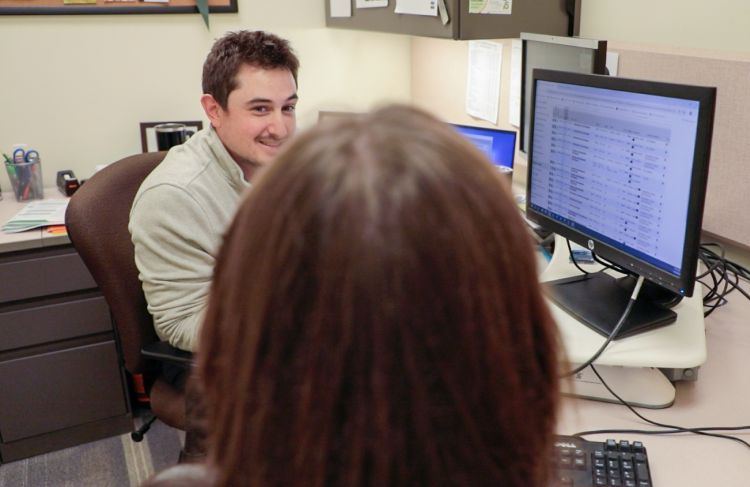 advisor and student, computer screen with class info visable