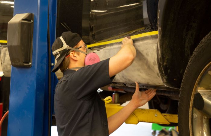 Auto Body student working on car