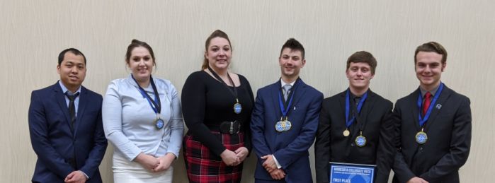 Six students at DECA sporting medals