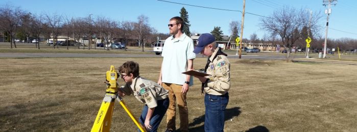Boy Scouts learning survey equipment
