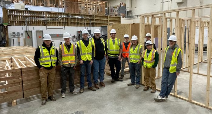 Carpentry students with lumber