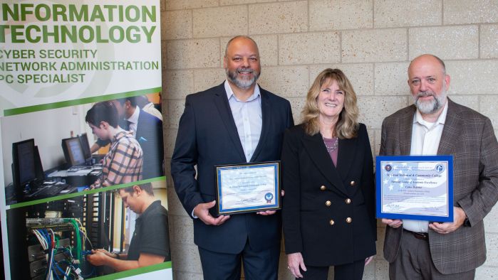 Ryan, Lori, Brian with certificates