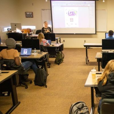 Marketing and Design students working on designs on computers