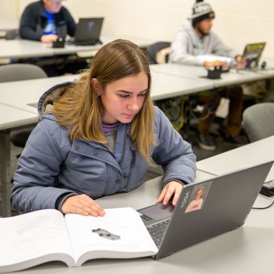 Mechanical design student with laptop