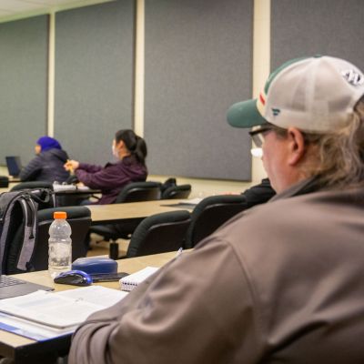 Accounting students in classroom with computers