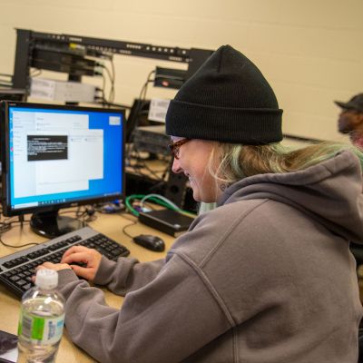Woman working on IT computers