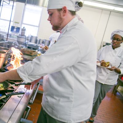 Culinary cooking on a gas range with fire