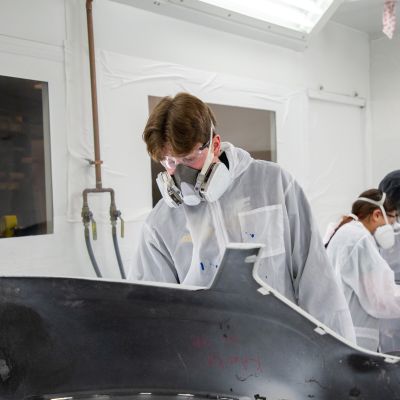 auto body students in paint booth