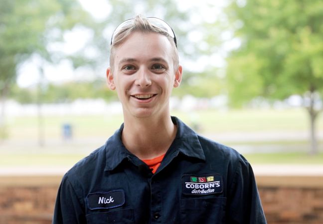 Nick Lamperes smiling with trees in background