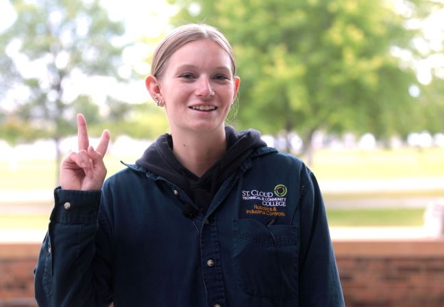 Samantha give a peace sign