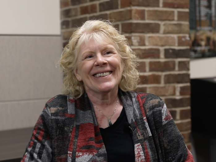 Judy Jacobson Berg smiling at camera