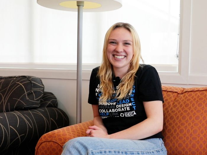 Dannilee Olson sitting on couch