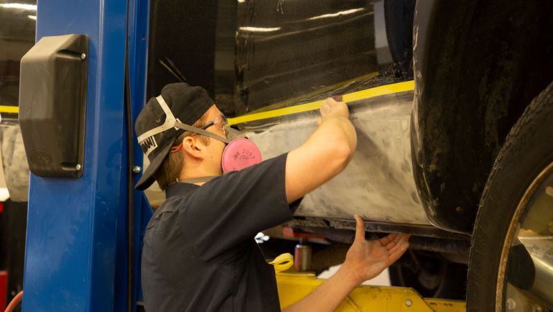 Auto Body student working on car