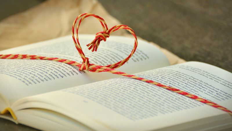 book with heart string