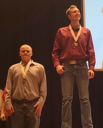Skills winners on podium with medals